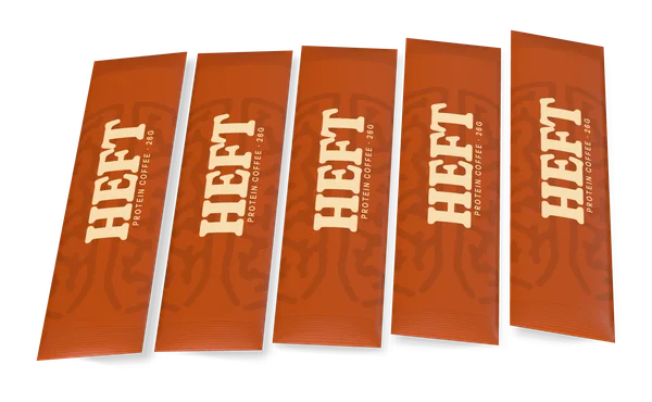 Five rust-coloured HEFT single-serve sticks laid side by side.